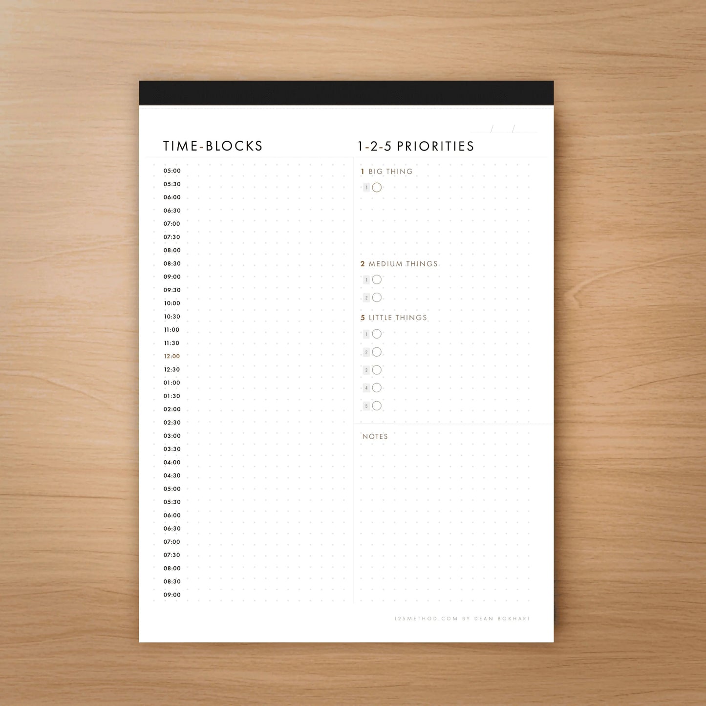 125 Time-blocks and priorities planner sheet on a wooden surface