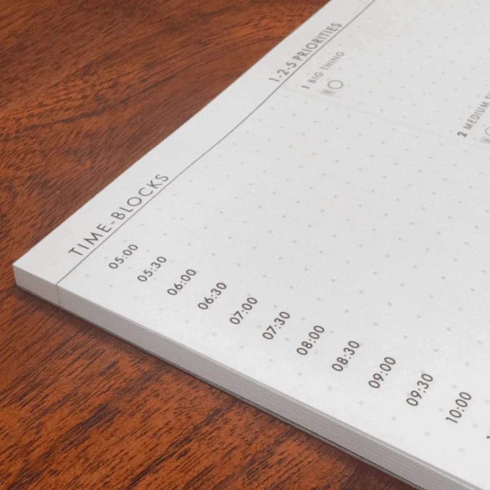 1-2-5 Time Block Planner in Medium on a wooden table