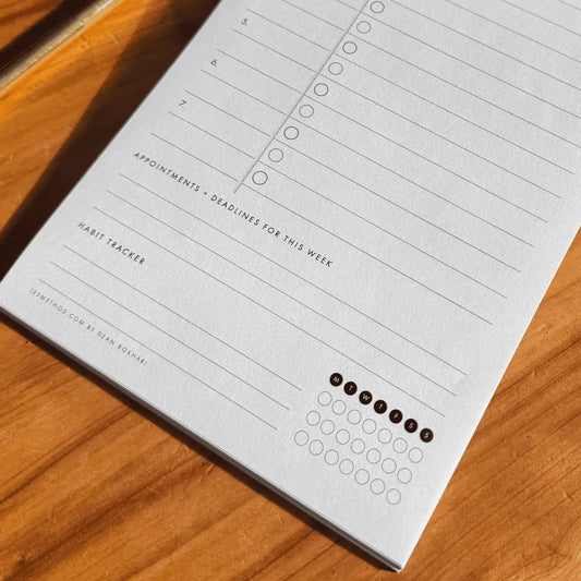 125Method™ notepad with appointment and habit tracker on a wooden surface