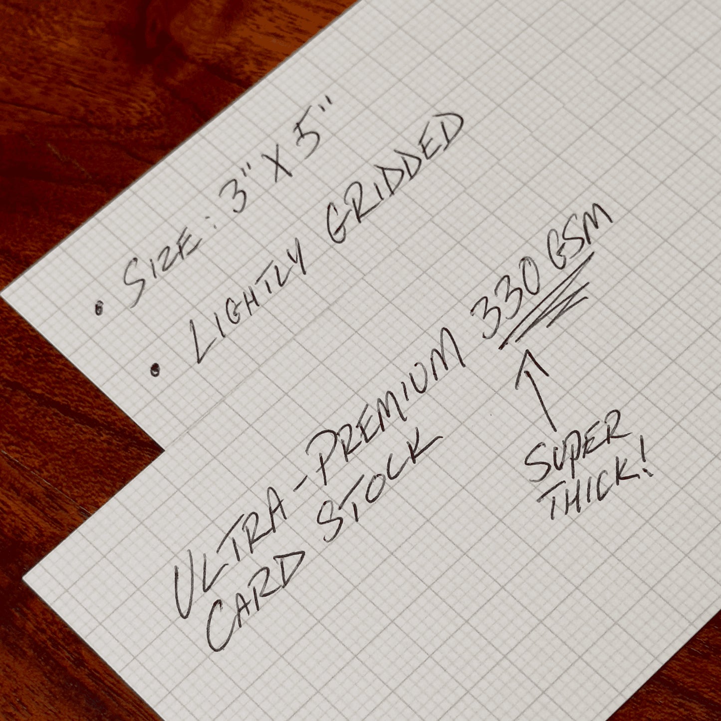 Capture Cards with text describing its features on a wooden surface