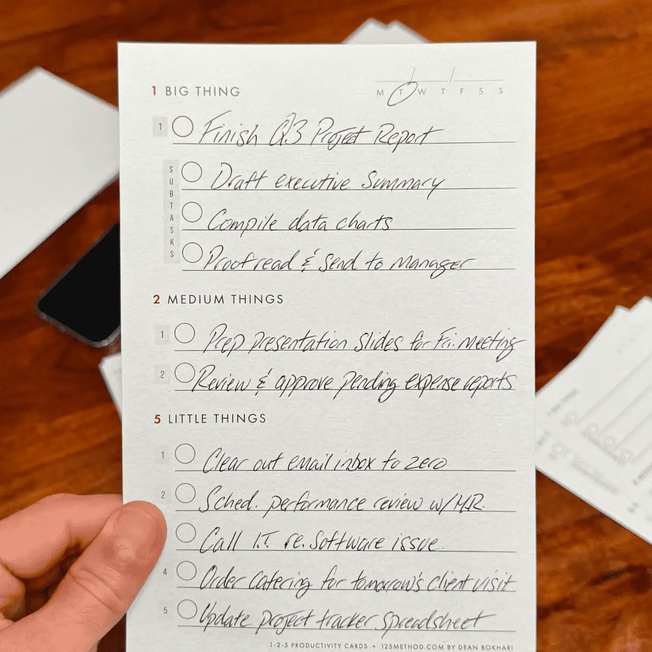 Close up of XL Daily Productivity Cards being held in someone's hand