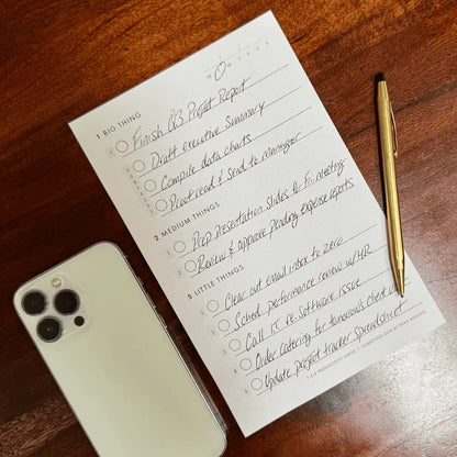 XL sized daily productivity cards with brass pen and iphone 