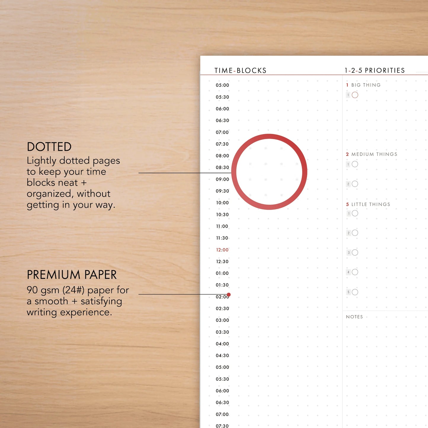Time management planner with time blocks and priority ratings on a wooden surface