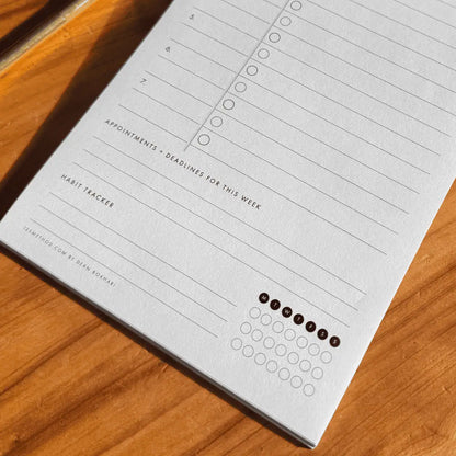 125Method™ notepad with appointment and habit tracker on a wooden surface